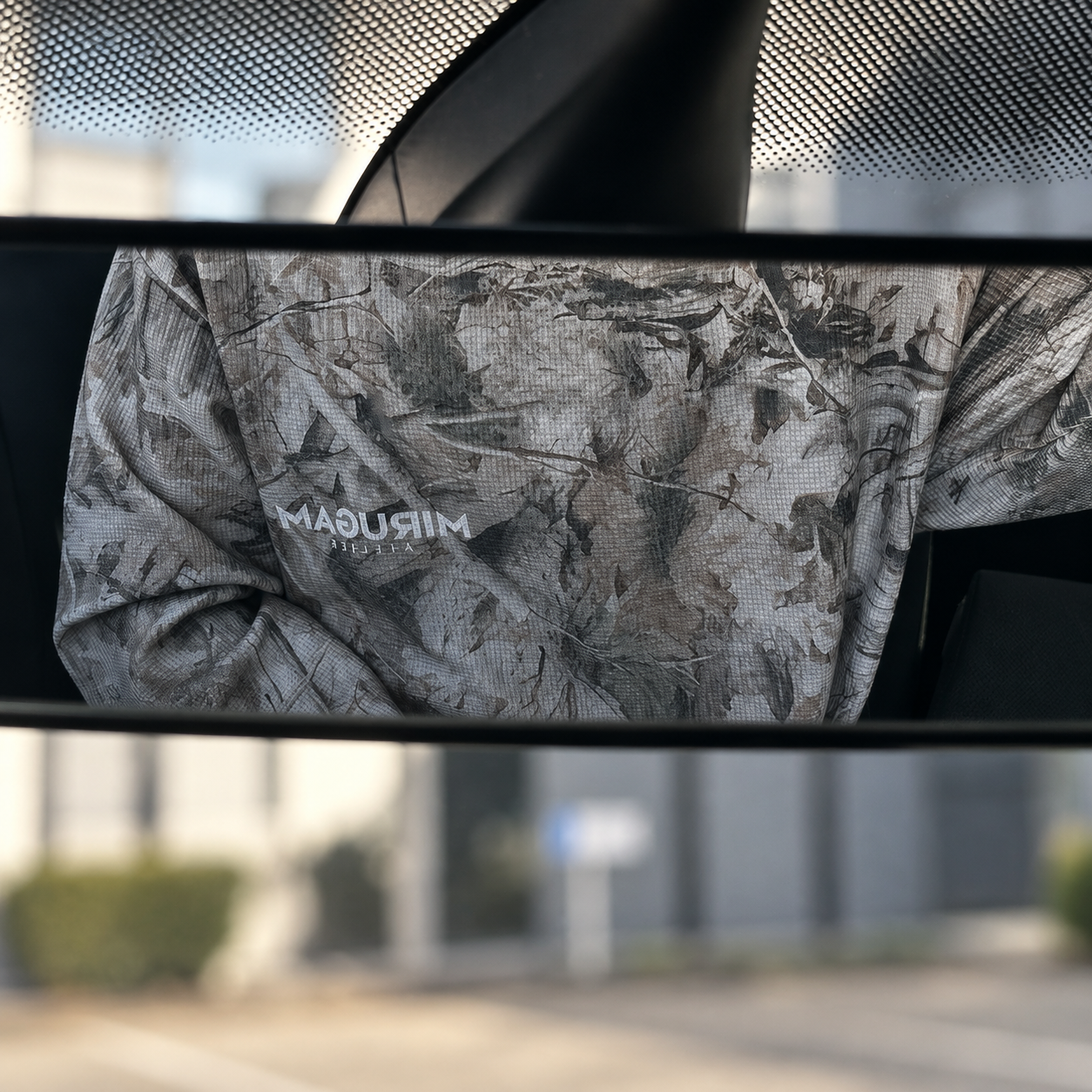 Mirugam Atelier tree-print fabric reflected in a rear-view mirror